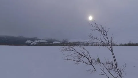 Snowmobile rides in front of the camera Stock Footage 282741771