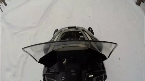 Snowmobile rides on the highway in the forest. Video stock 69082185