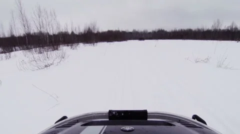 Snowmobile rides on winter field. Stock Footage 47482880