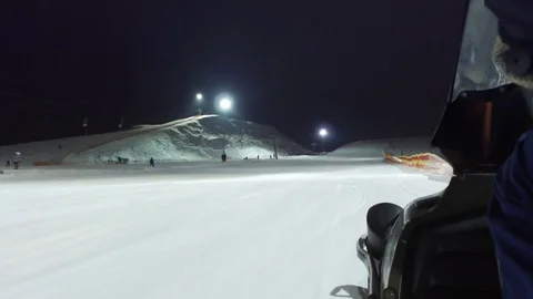 Snowmobile rises up on ski slope Stock Footage 71474684
