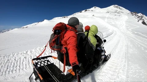 Snowmobile rises uphill Stock Footage 87649041