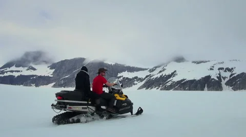 Snowmobile on snow field - Alaska, two footage Stock Footage 39978336