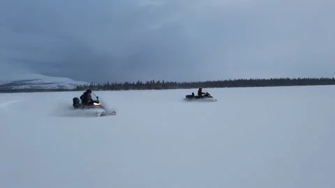 Snowmobile at speed. Red sun at sunset 스톡 동영상 249390647