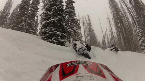 Snowmobile stuck upside down in the snow 1.mp4 Stock Footage 10929736