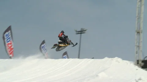 Snowmobile Takes Jump Low Angle Видео 38720932