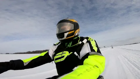 Snowmobiling Man Drives Past a Patch of Trees Video stock 130213572