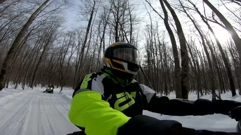 Snowmobiling Man Driving Through Woods Meeting other Snowmobiles Stock-Footage 130214588