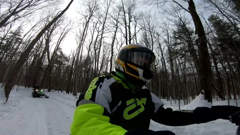 Snowmobiling Man Driving Through Woods Vídeos de archivo 130214647