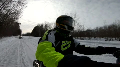 Snowmobiling Man with Low Trees in Background 스톡 동영상 130213566