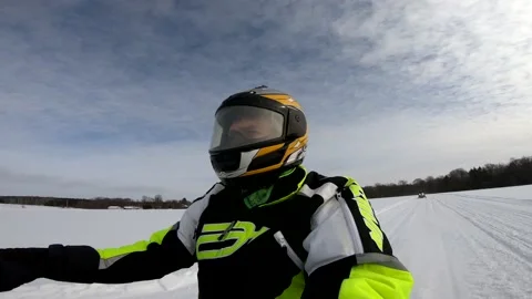 Snowmobiling Man in an Open Field and Crossing a Road 스톡 동영상 130214086
