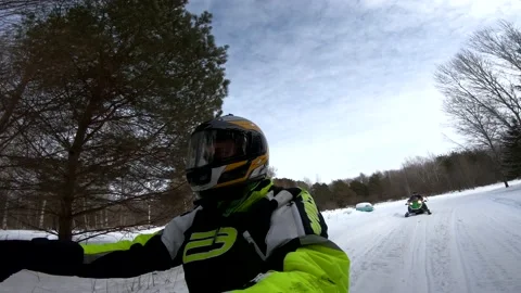Snowmobiling Man with Some Trees in Background Vídeos de archivo 130214828