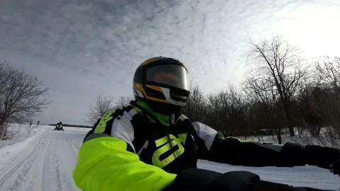 Snowmobiling Man with Trees in the Background Vídeos de archivo 130215324
