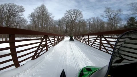 Snowmobiling Onboard View of Woods and Over a Bridge Vídeos de archivo 130218427