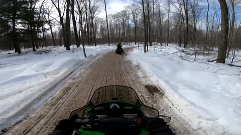 Snowmobiling POV Through Trees and Driving on Dirty Snow Video stock 130219609