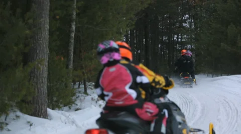 SNOWMOBILING ON A TRAIL Stock Footage 35512849