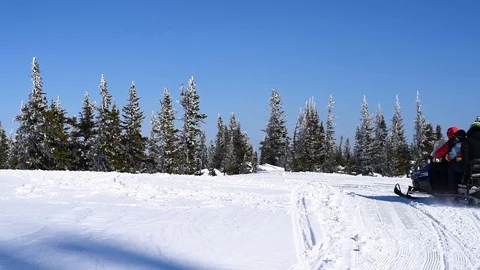 Snowmobiling in winter in the mountains Stock Footage 105040703