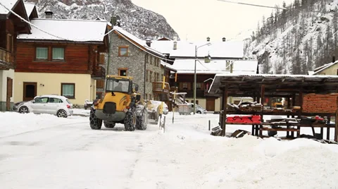 Snowplough clearing winter street Stock Footage 33364069