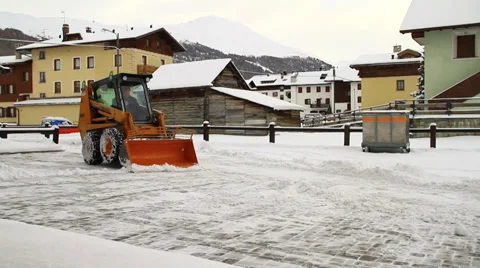 Snowplough clearing winter street Stock Footage 33366199