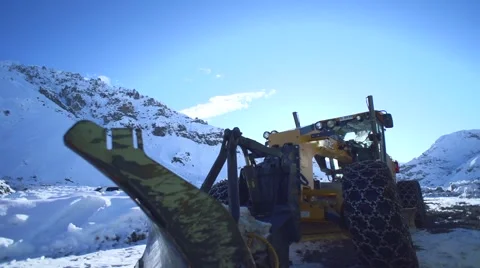 Snowplow in the middle of the mountains 스톡 동영상 53203298