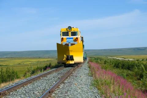 The snowplow on the most northern railroad in the sunny summer day. Yamal Stock Photos