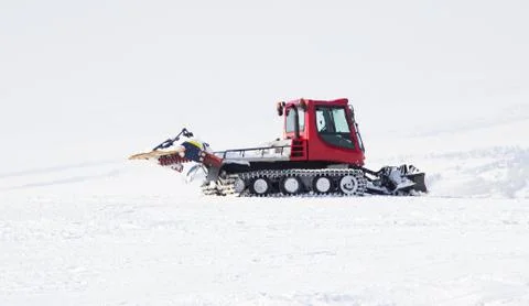 Snowplow in the mountains Stock Photos