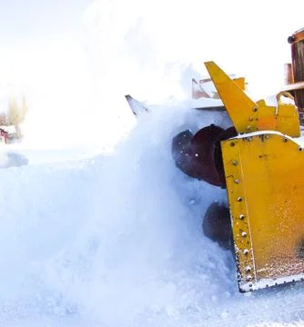 Snowplow in the mountains Stock Photos