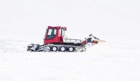 Snowplow in the mountains Stock Photos