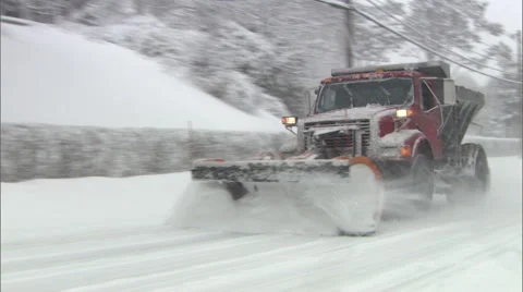 Snowplow passes by in Winter Storm Stock Footage 47678405