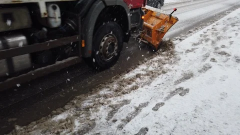 Snowplow tractor on duty under snowfall Video stock 129956400