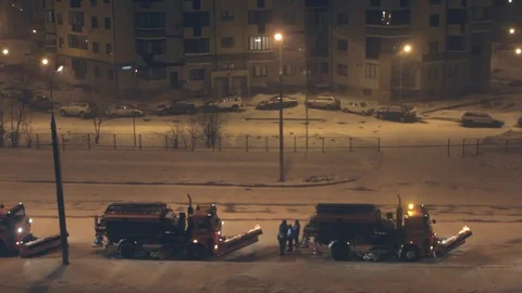 Snowplows in the city at night. Stock Footage 80717902