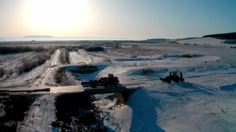 Snowplows Clearing a Remote Road Junction in Winter Stock Footage 345011509