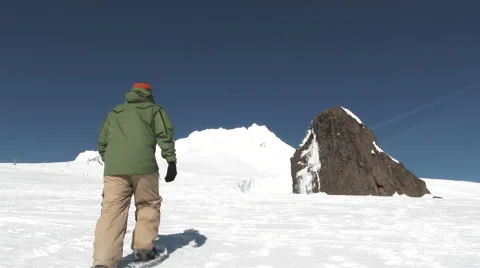 Snowshoeing Up Mountain Peak Video stock 59611520