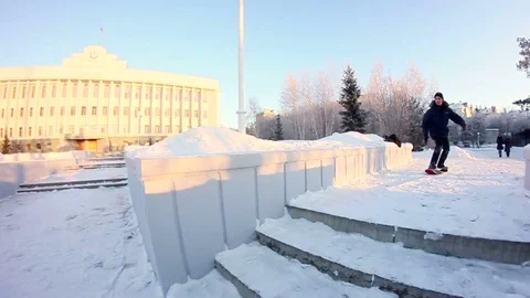 Snowskater slides on the ledge Stock Footage 69788693