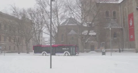 Snowstorm blizzard and white winter street scenery in German city Brunswick Stock Footage 148979777