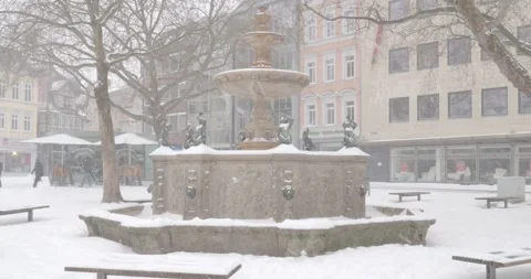 Snowstorm blizzard and white winter street scenery in German city Brunswick Stock Footage 149678936