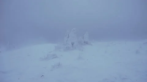 Snowstorm far in the mountains Stock Footage 130745106