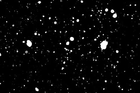 Snowstorm texture on a black background. Stock Photos