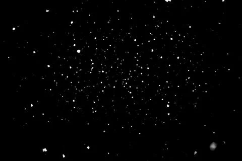 Snowstorm texture on a black background. Stock Photos