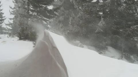 Snowstorm in winter mountains Stock Footage 125056243