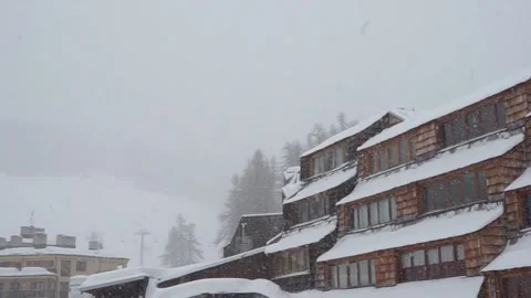 Snowy alpine housing complex Stock Footage