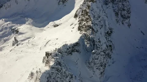 Snowy Alpine Mountain Peak Under Clear Sky Stock Footage 332010320