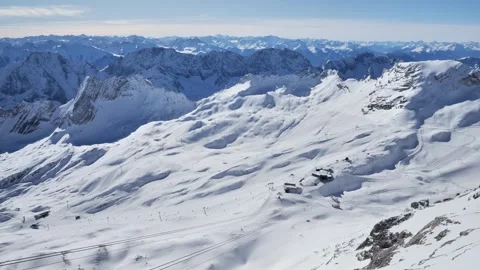 Snowy alpine ski slopes and mountain panorama near the Zugspitze viewpoint Stock Footage 331256935