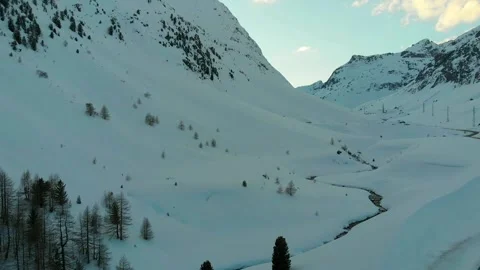 Snowy Alpine Valley with Mountain Stream Stock Footage 341608050