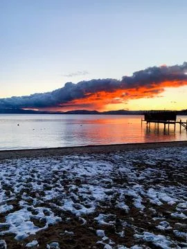 Snowy Beach Sunset Stock Photos