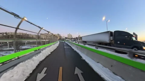 Snowy Bridge Path POV Ride Over Hudson River at Sunset Stock Footage 331927734