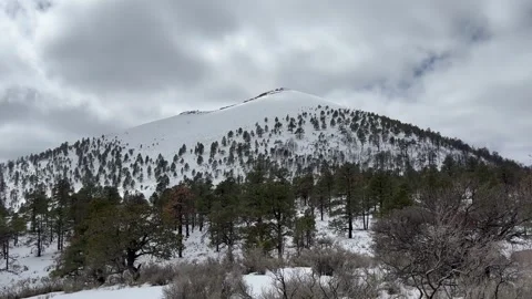 Snowy Cinder Cone Volcano In Sunset Crater National Monument, Arizona Stock Footage 284749242