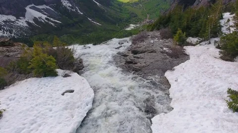 Snowy Colorado High Mountain River Falling Over Enormous Cliff Stock Footage 77733388