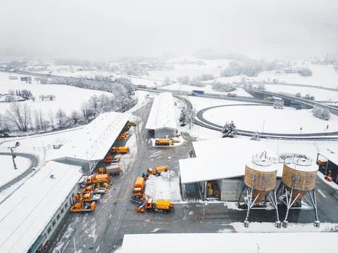 Snowy day causing a lot of work for highway maintenance workers - Aerial view of Stock Photos