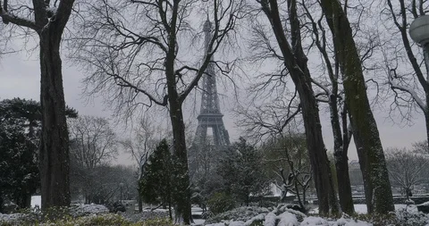 Snowy Eiffel Tower in snow covered gardens, winter in Paris, France Stock Footage 94010611