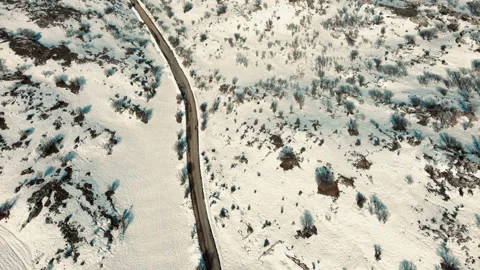 Snowy empty mountain road view from above, Snowy mountains trees Snowy Nature Stock Footage 237167105